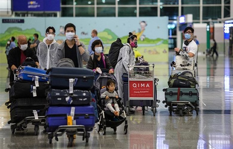 Hong Kong bans flights as Omicron surges around globe