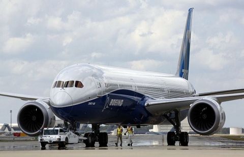 In this March 31, 2017, file photo, Boeing employees walk the new Boeing 787-10 Dreamliner down towards the delivery ramp area at the company's facility in South Carolina after conducting its first test flight at Charleston International Airport in North Charleston, S.C.