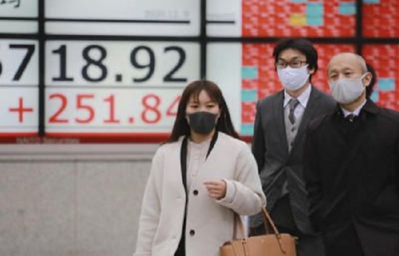 Asian markets fall as virus surge leads to new lockdowns