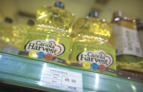 Beijing: Bottles of Canola Harvest brand canola oil, manufactured by Canadian agribusiness firm Richardson International, are seen on the shelf of a grocery store on Wednesday.
