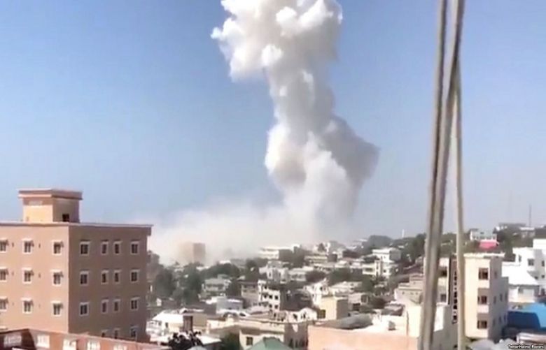 Smoke rises after an explosion in Mogadishu, Somalia, Dec. 22, 2018, in this still image taken from social media video.