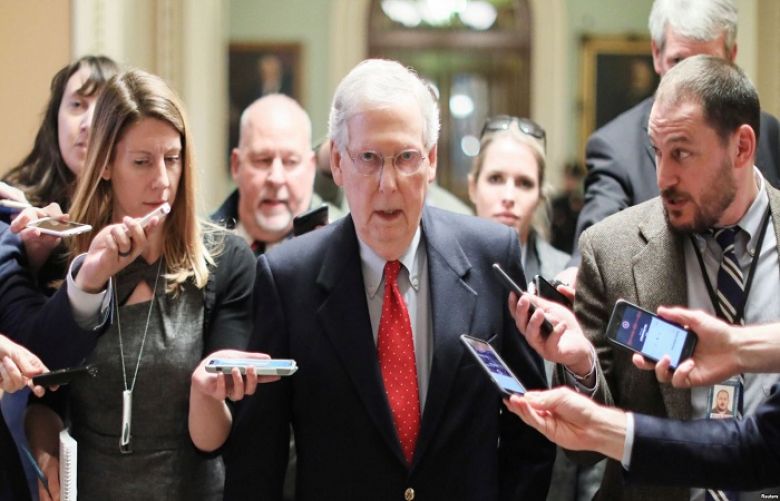 U.S. Senate Majority Leader Mitch McConnell, R-Ky., is surrounded by reporters as he returns from meeting with President Donald Trump and Democratic leaders at the White House, at the U.S. Capitol in Washington, Jan. 2, 2019.
