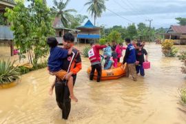 Floods and landslide kill more than a dozen people in Indonesia’s Sulawesi island