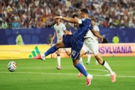 Mbappe double sends France into knockout rounds after lengthy weather delay