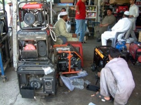 A Mechanic Busy In Repairing Power Generators